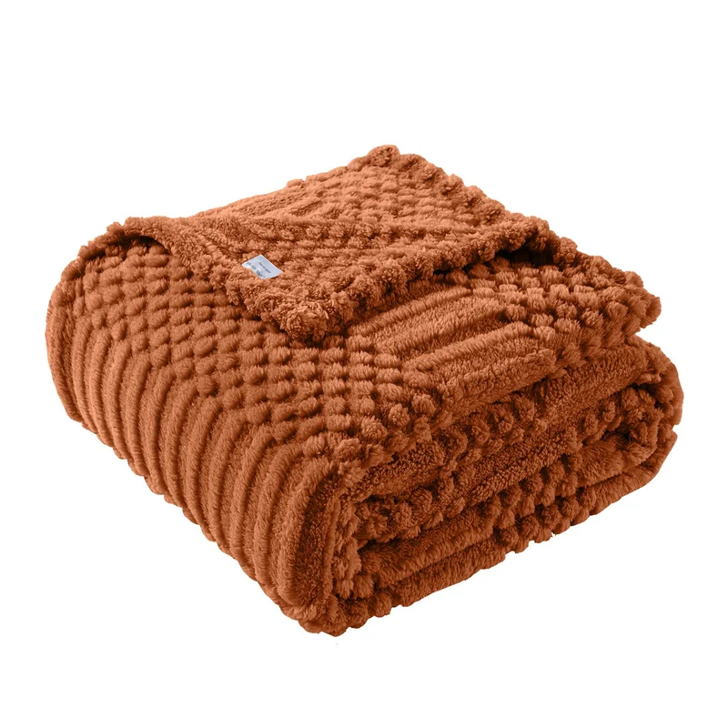Lussena Rust Fleece Throw: fluffy 50x60 fleece throw in a warm rust tone.